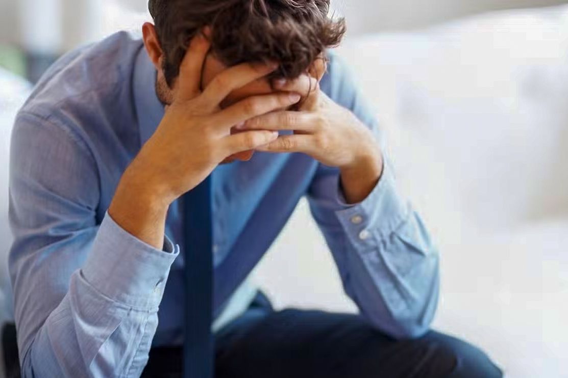 Frustrated middle-class American taxpayer reviewing financial documents